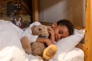 Child Asleep With Teddy